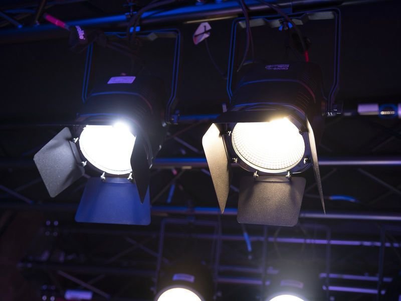 Focused production lighting on a performer