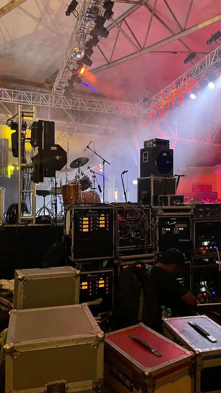 Concert stage with professional lighting and large audience